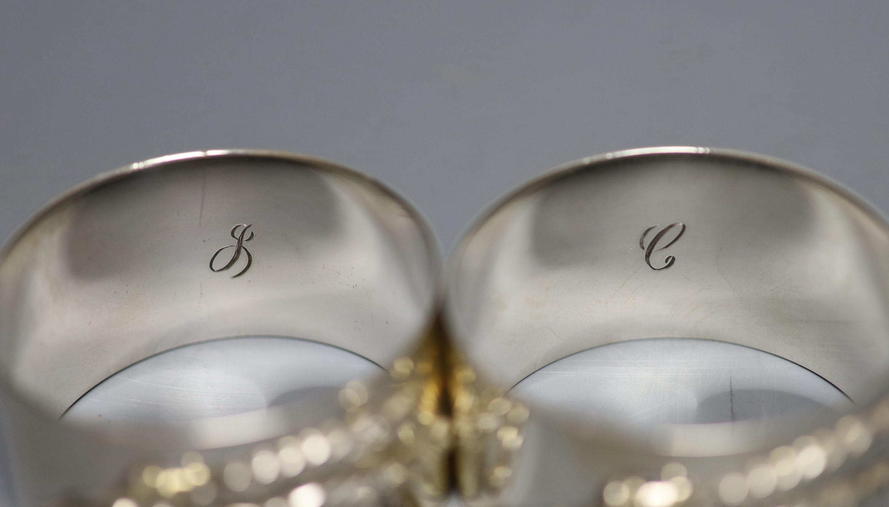 A modern pair of silver napkin rings cast with mice and wheatsheaf, by Sarah Jones, London, 1986, 45mm, 84 grams.